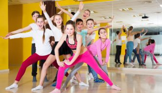 dance class group with boys and girls and instructor