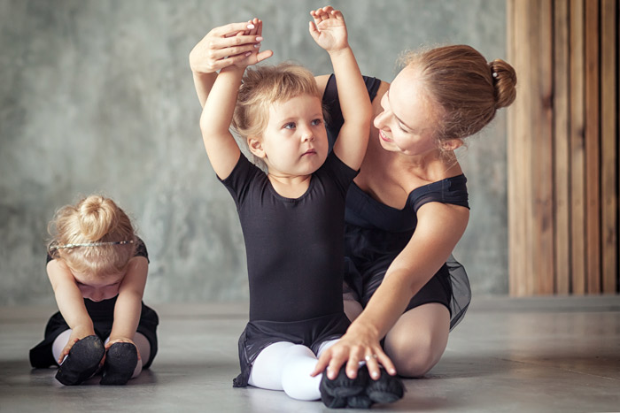 dance instructor with two preschool dance students