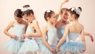 group of young ballerina girls wearing light blue dance dresses