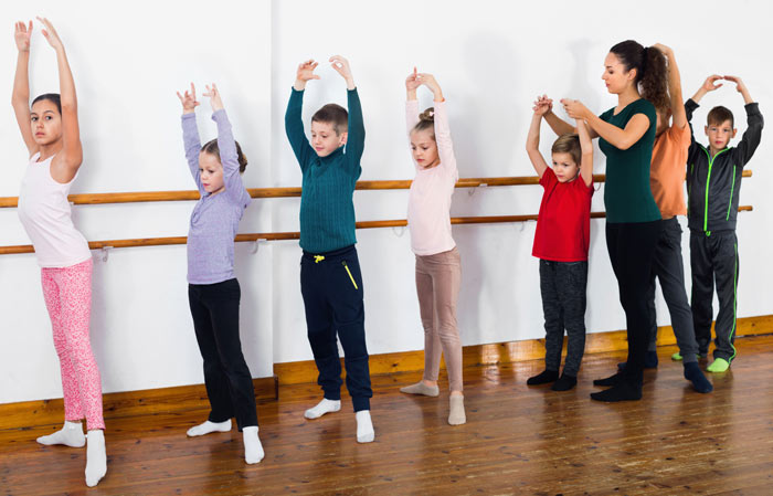 coed dance students in class with teacher