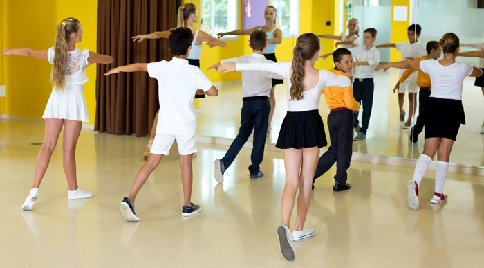 dance instructor with class with boy and girl dancers