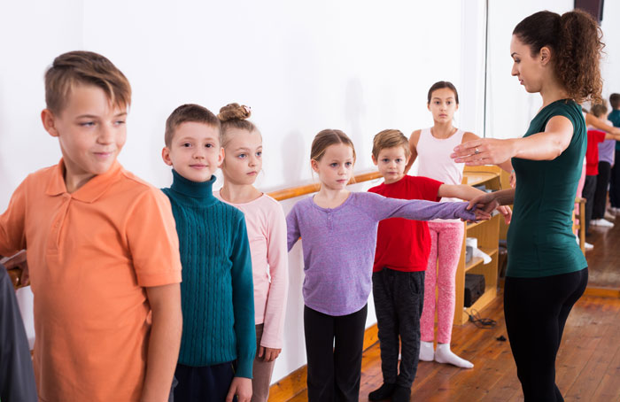 dance teacher with boys and girls as dance students