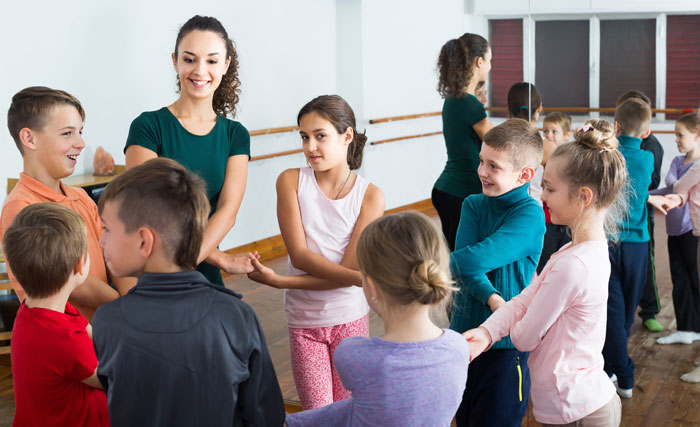 dance teacher with coed dance students