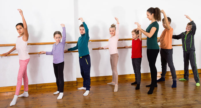dance teacher with guys and girls as dance students