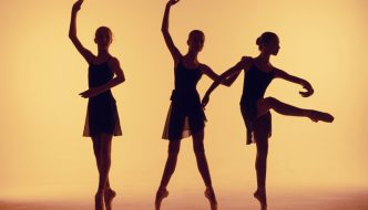 teenage girl ballerinas working on dance positioning