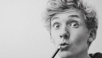 goofy teen guy comedian with pencil to his lips