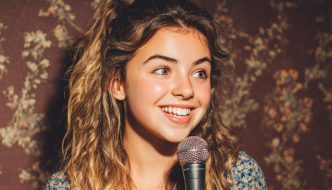 teen girl comedian with microphone during performance